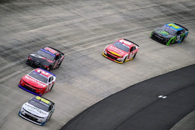 AJ Allmendinger and others race at Dover.