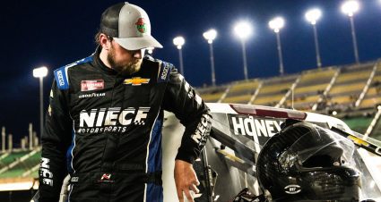 Kaden Honeycutt stands next to his truck after the NASCAR Craftsman Truck Series race at Kansas.
