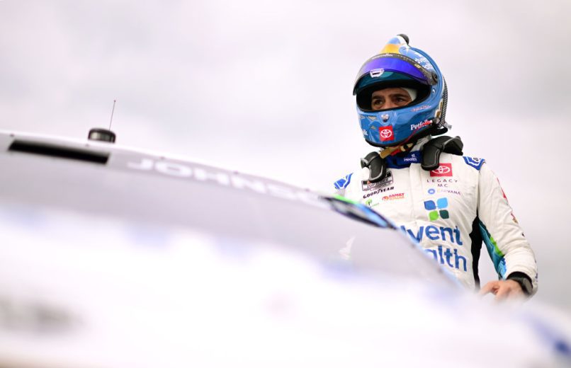 Jimmie Johnson climbs in his car