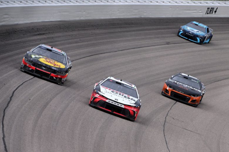 NASCAR Cup Series cars race at Kansas Speedway.