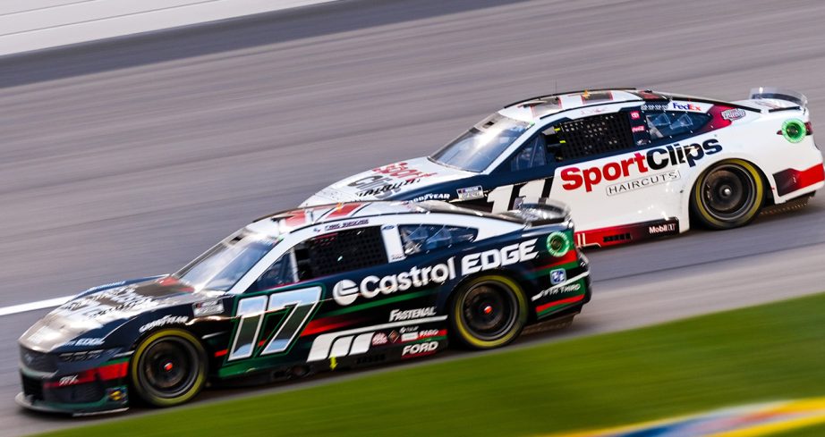 Chris Buescher and Denny Hamlin battle at Kansas.