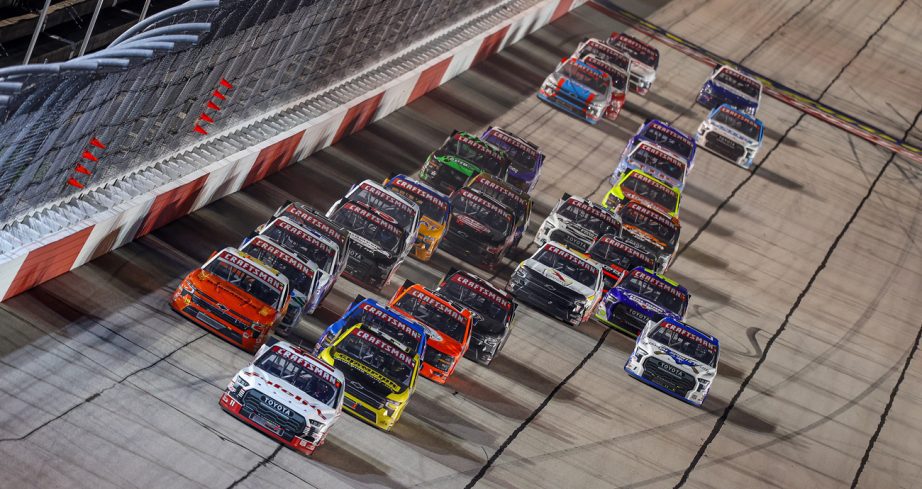 NASCAR Craftsman Truck Series vehicles race at Darlington.