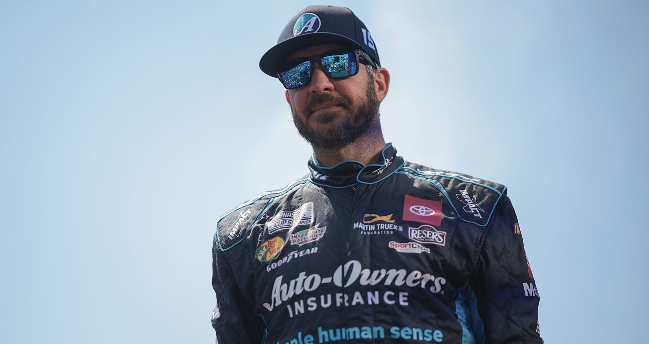 Martin Truex Jr. walks at Darlington ahead of a NASCAR Cup Series race.