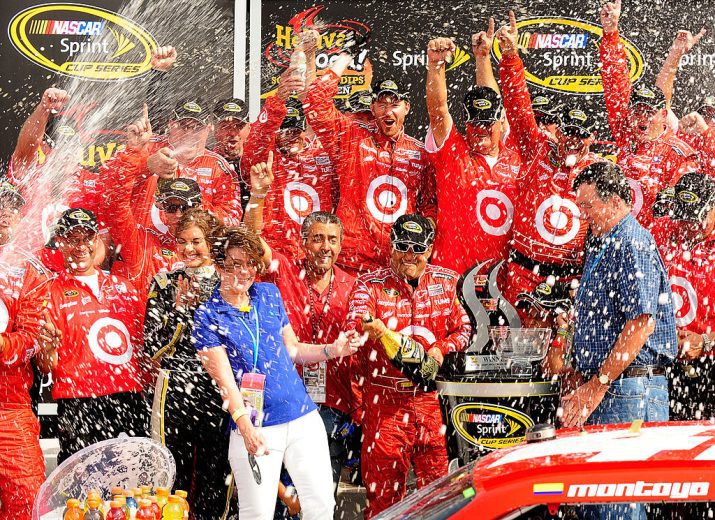 Juan Pablo Montoya and his pit crew celebrate in Victory Lane at Watkins Glen International.