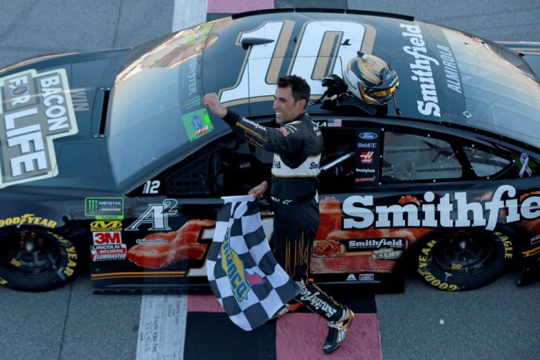 Aric Almirola celebrates following his NASCAR Cup Series win at Talladega Superspeedway.