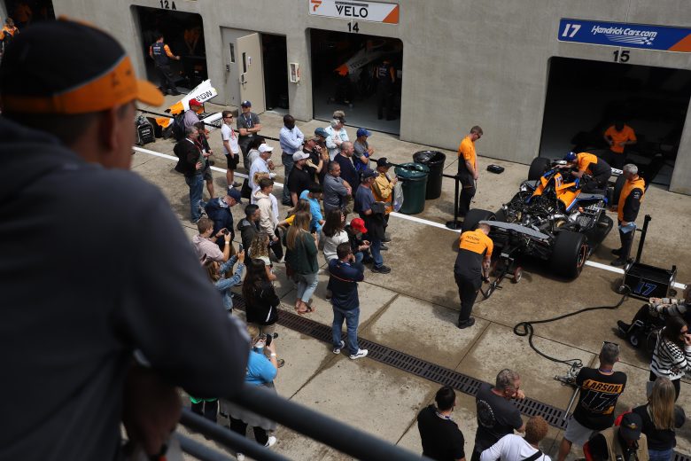 Fans gather to see the No. 17 Arrow McLaren crew work on the Chevrolet.