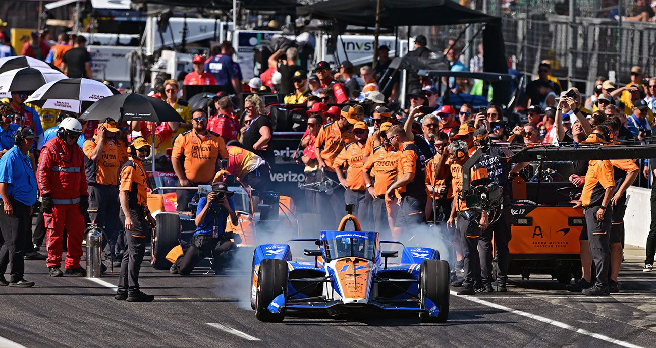 Kyle Larson's No. 17 Chevrolet spits up smoke as it pulls away