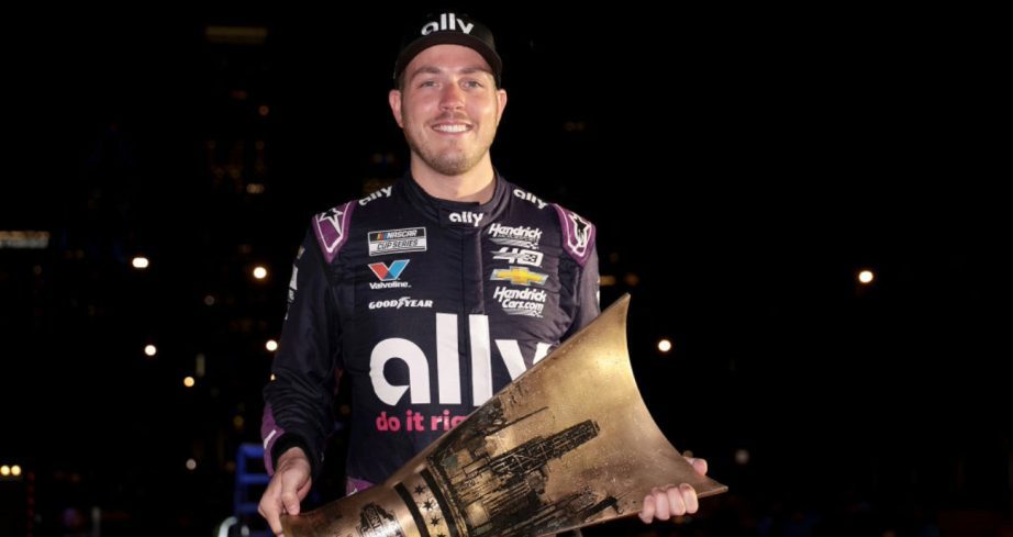 Alex Bowman holds the trophy after winning at Chicago.