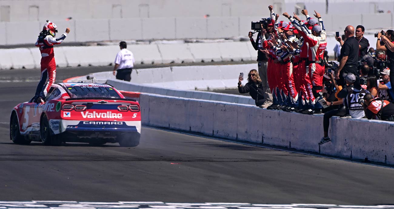 Kyle Larson and his pit crew celebrate their victory on pit road at Sonoma Raceway.