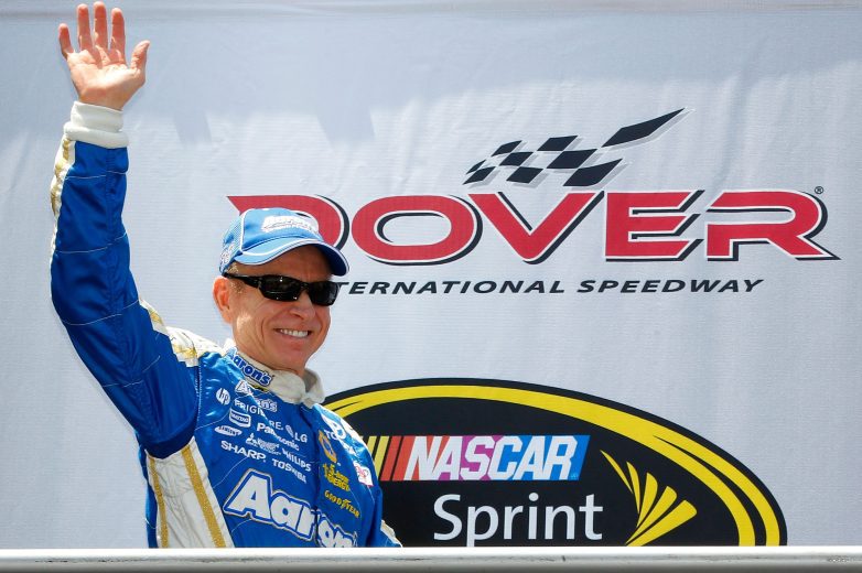 Mark Martin waves to fans during pre-race festivities at Dover International Speedway.