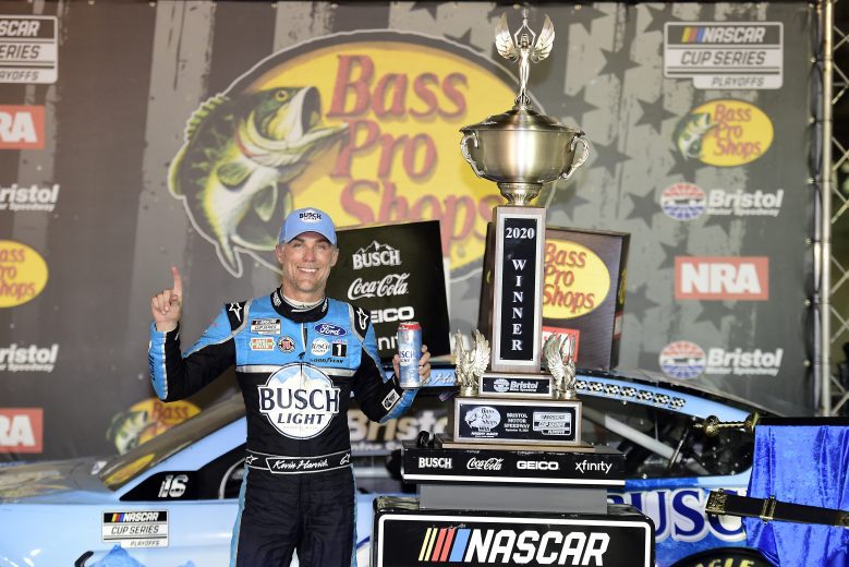 Kevin Harvick poses with a trophy after a win at Bristol.