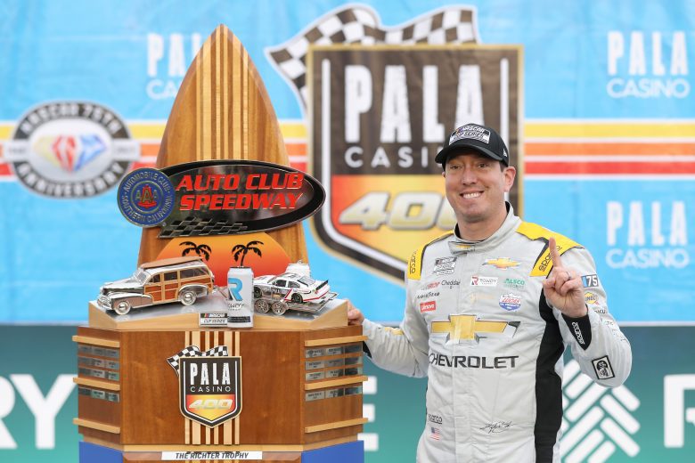 Kyle Busch poses with trophy after win at Auto Club in 2023.