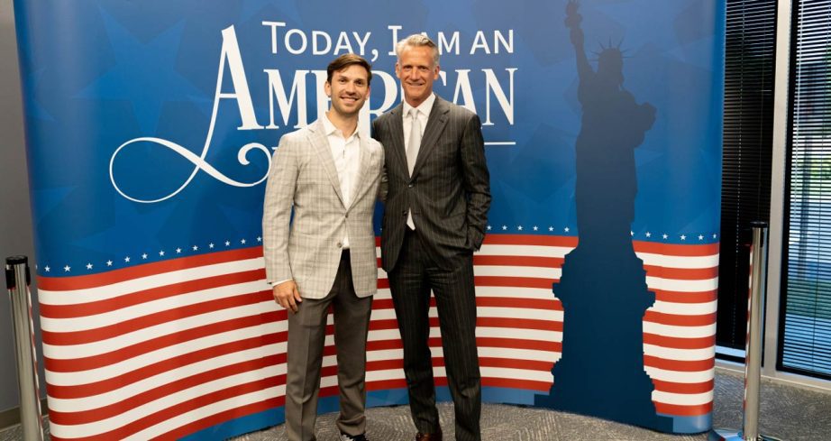 Daniel Suárez (L) and NASCAR President Steve Phelps (R) pose for a photo during Suárez's naturalization ceremony.
