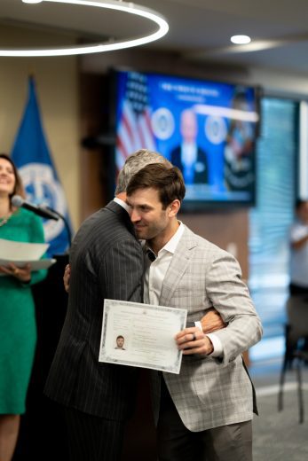 Daniel Suárez embraces NASCAR President Steve Phelps.