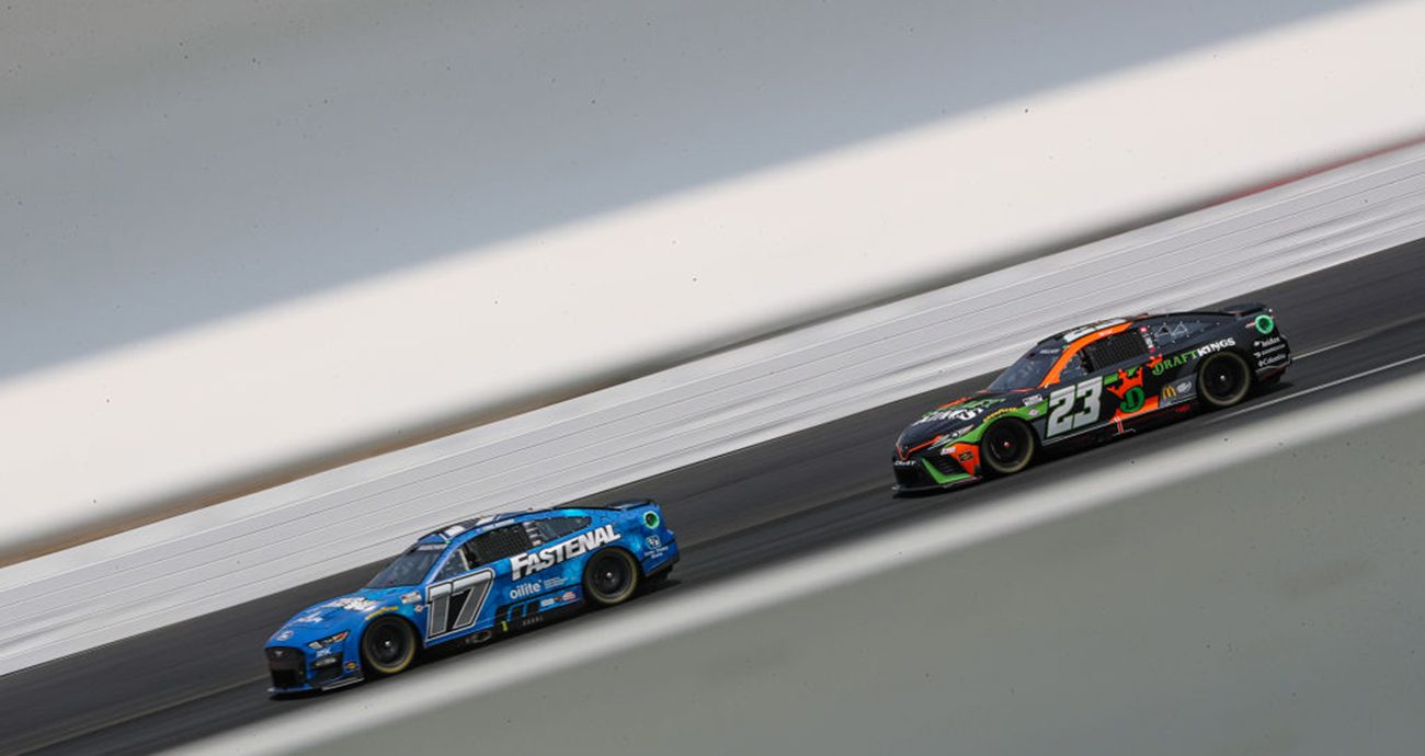 Chris Buescher and Bubba Wallace drive at New Hampshire.