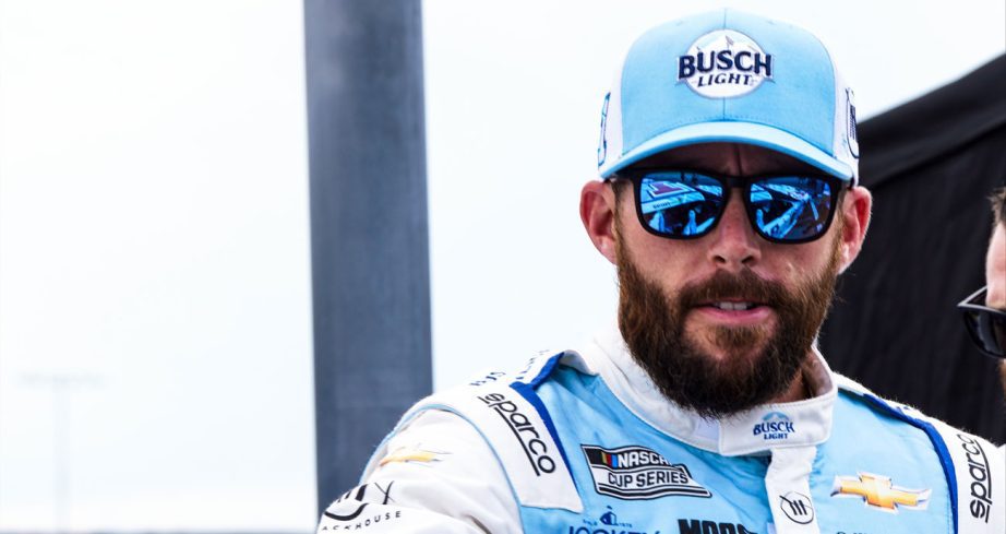 Ross Chastain in Busch Light hat and fire suit