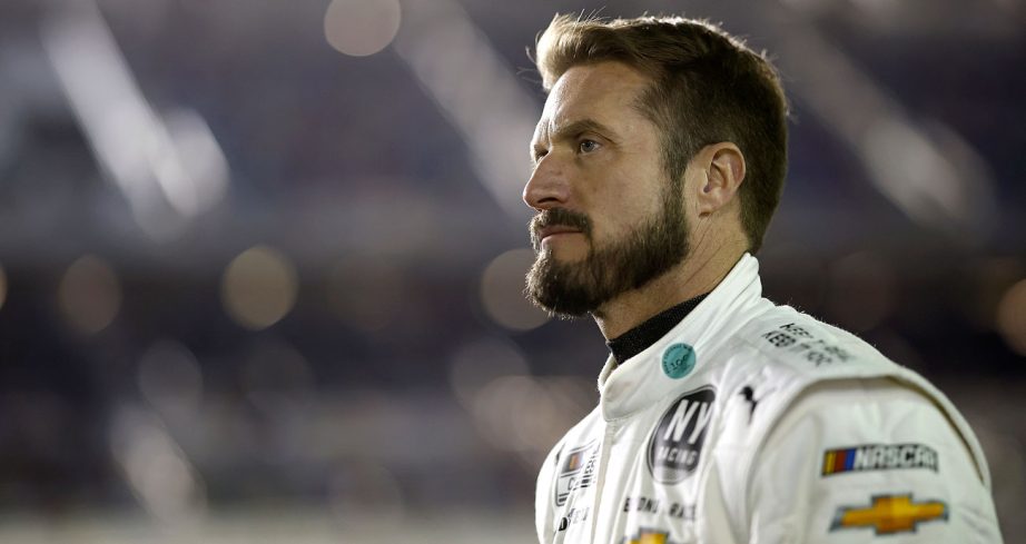 Jj Yeley looks on.
