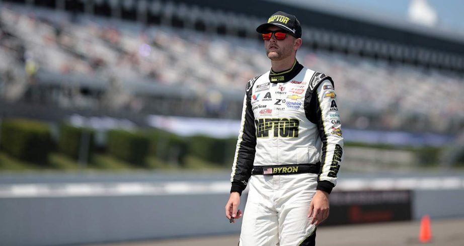 No. 24 Chevy driver William Byron walks on the qualifying grid on Pocono Raceway's pit road