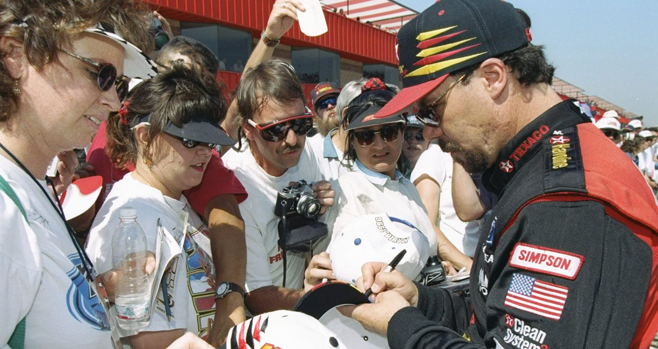 Ernie Irvan signs autographs in 1997.