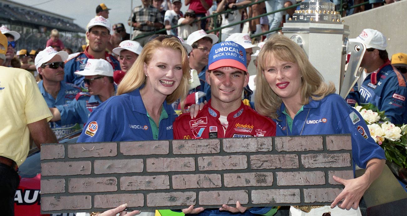 Jeff Gordon poses for a photo while holding the Indianapolis Motor Speedway bricks following his 1994 Cup Series win at the track.
