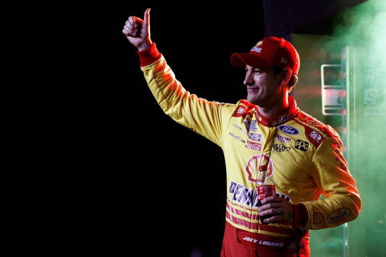 Joey Logano waves to the crowd before a NASCAR Cup Series race.