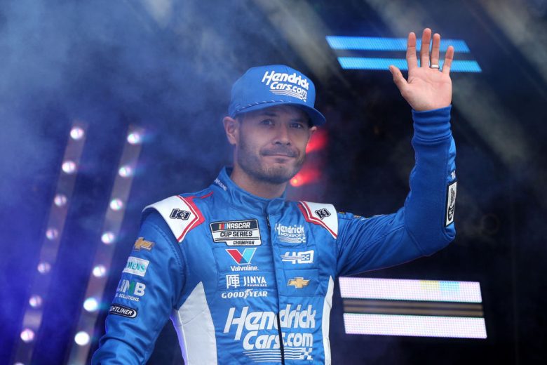 Kyle Larson waves to the crowd before a NASCAR Cup Series race.