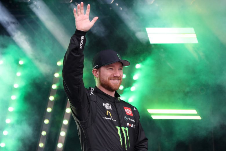 Tyler Reddick waves to the crowd before a NASCAR Cup Series race.