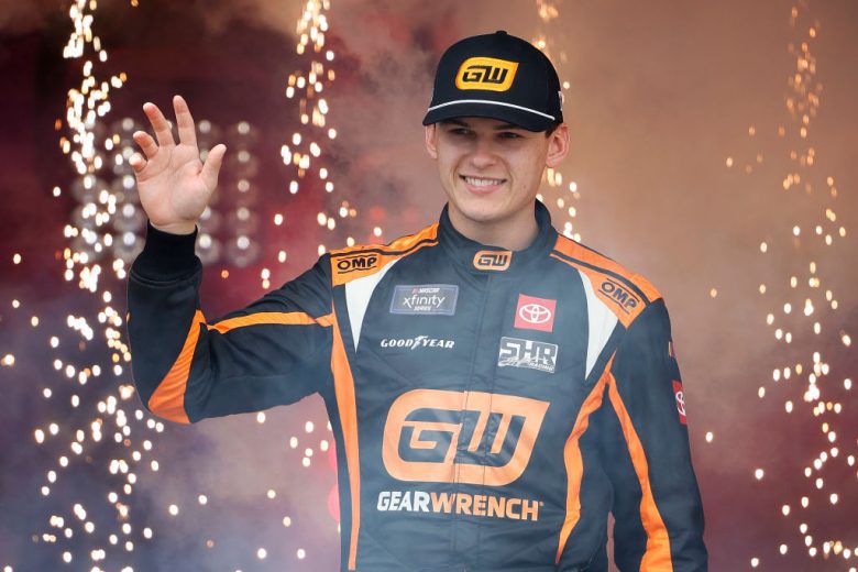 Corey Heim waves to the crowd before a NASCAR Xfinity Series race.