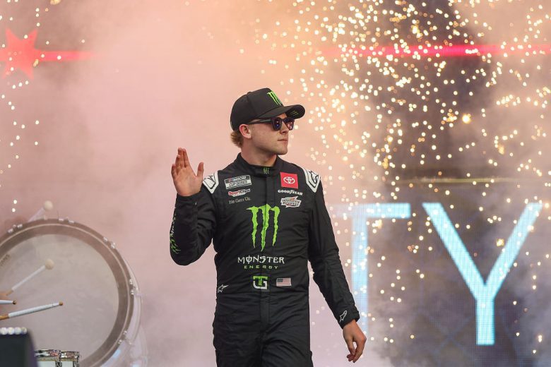 Ty Gibbs waves to the crowd before a NASCAR Cup Series race.