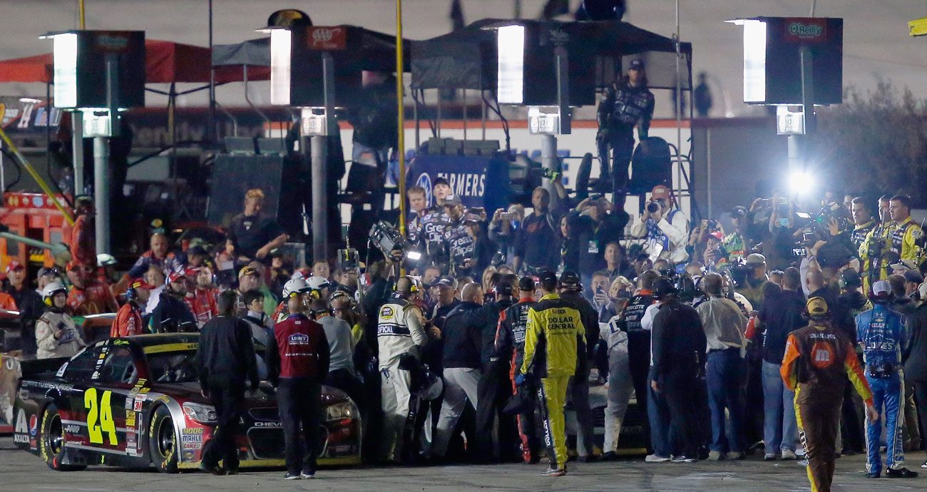 A view of pit road as Jeff Gordon and crew confronts Brad Keselowski and crew after the 2014 playoff race at Texas Motor Speedway.