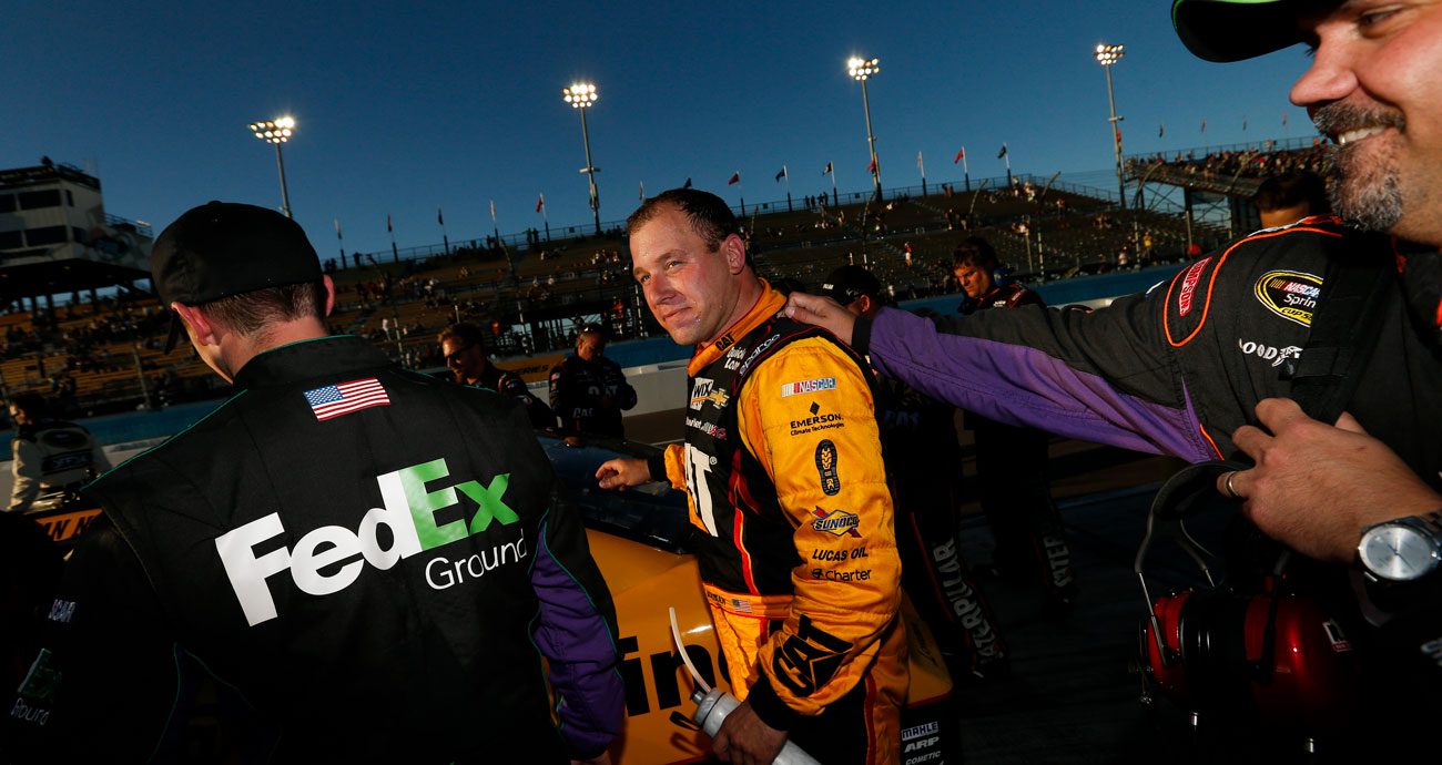 Ryan Newman stands outside his car after the 2014 playoff race at Phoenix Raceway.
