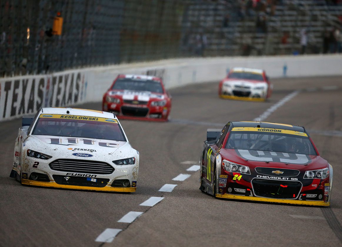 Brad Keselowski and Jeff Gordon race on track at Texas in 2014 playoffs.