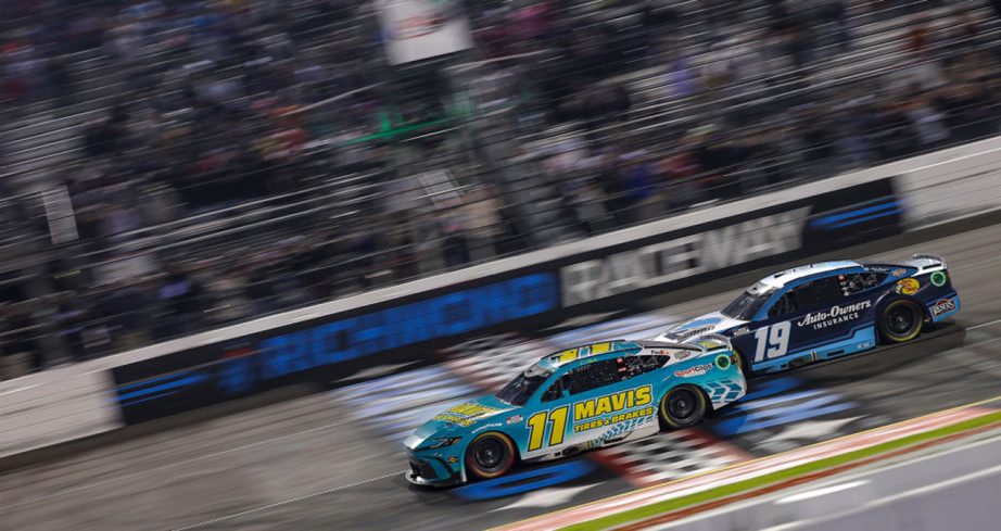 Denny Hamlin races ahead of Martin Truex Jr. at the finish line at Richmond Raceway.