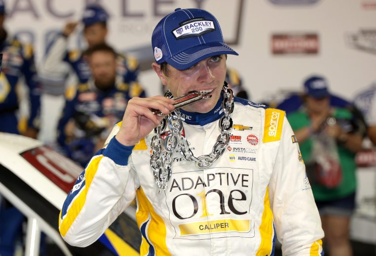 Christian Eckes bites chain in VIctory Lane at Nashville.