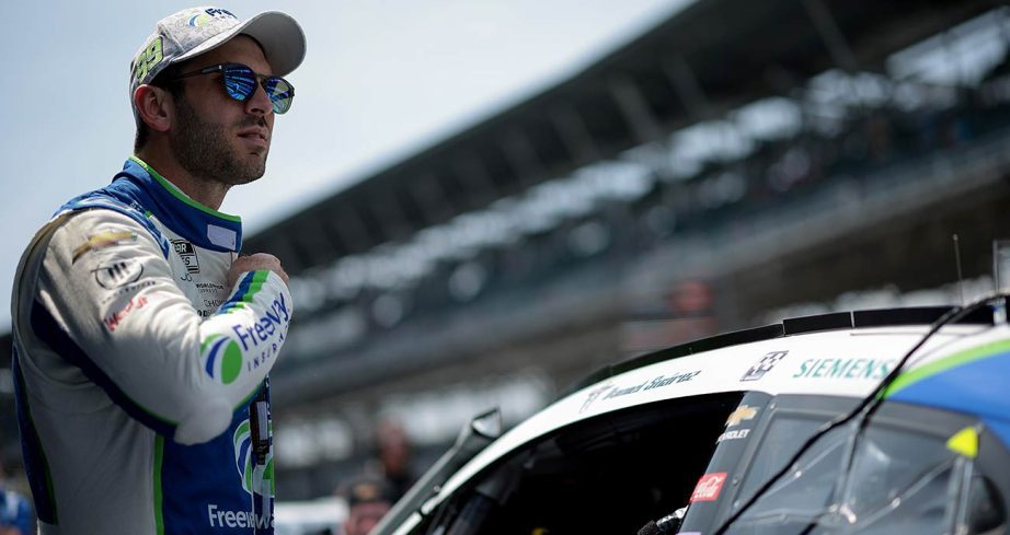 Daniel Suárez suits up on the grid at Indianapolis Motor Speedway