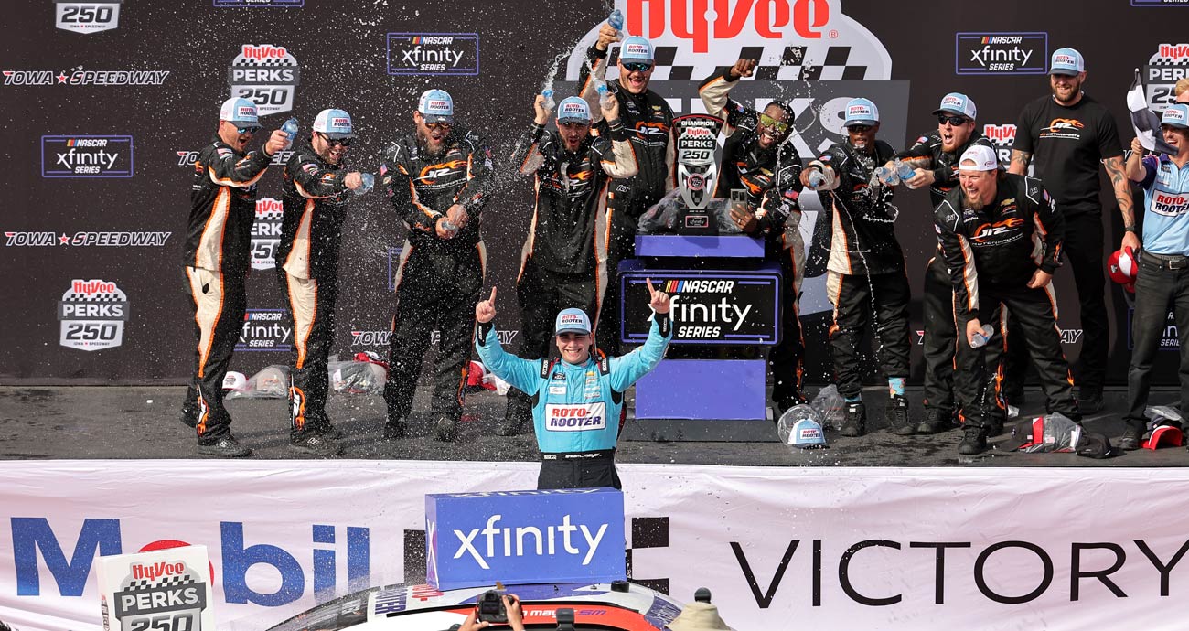 Sam Mayer celebrates in Victory Lane following his NASCAR Xfinity Series win at Iowa Speedway.