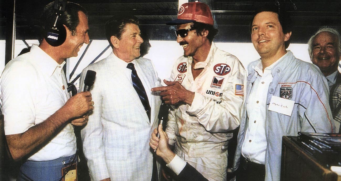 Richard Petty (R) speaks with Ronald Reagan (L) at Daytona International Speedway.