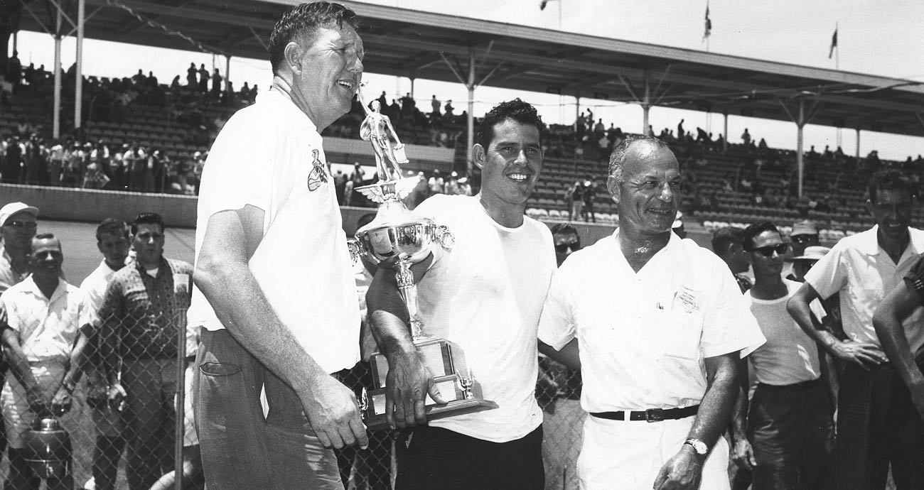 David Pearson, (C) poses for a photo with Bill France Sr. (R) following the former's NASCAR Cup Series victory at Daytona International Speedway.