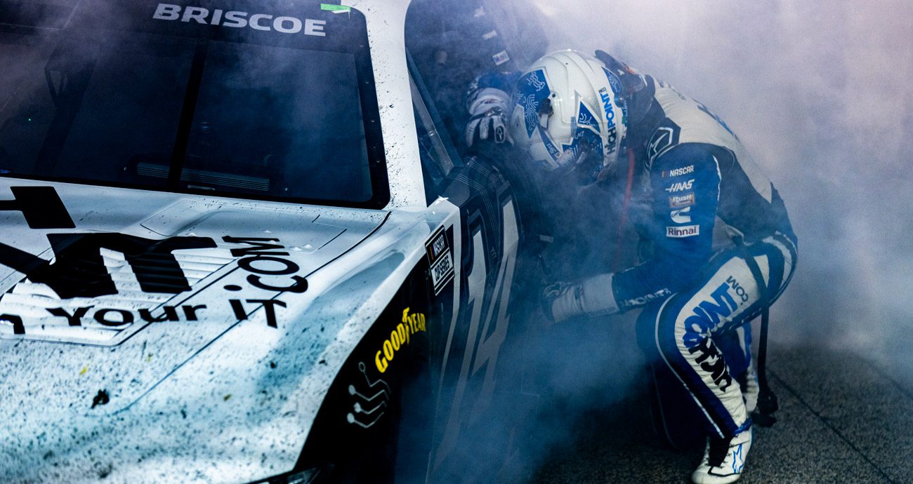Chase Briscoe kneels after winning the Southern 500 at Darlington.