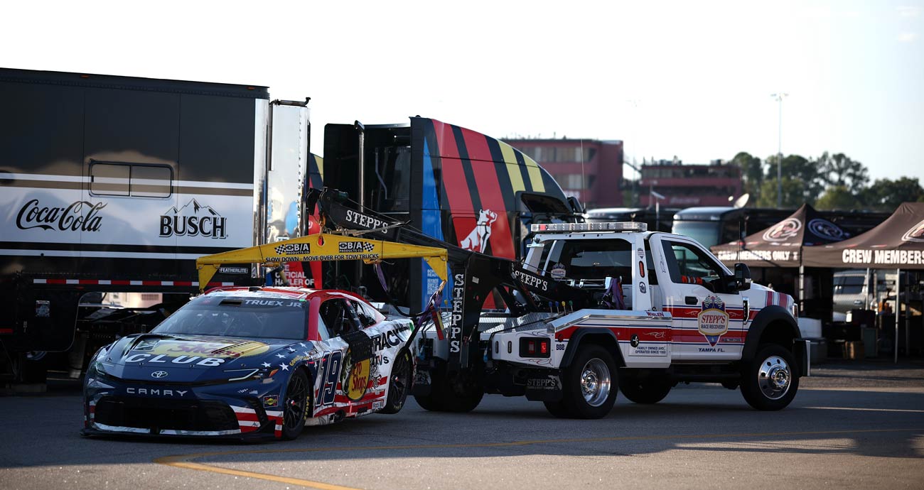 Martin Truex Jr.'s No. 19 Joe Gibbs Racing Toyota gets towed away following a wreck at Darlington Raceway.