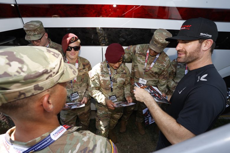 Corey LaJoie speaks with U.S. military service members.