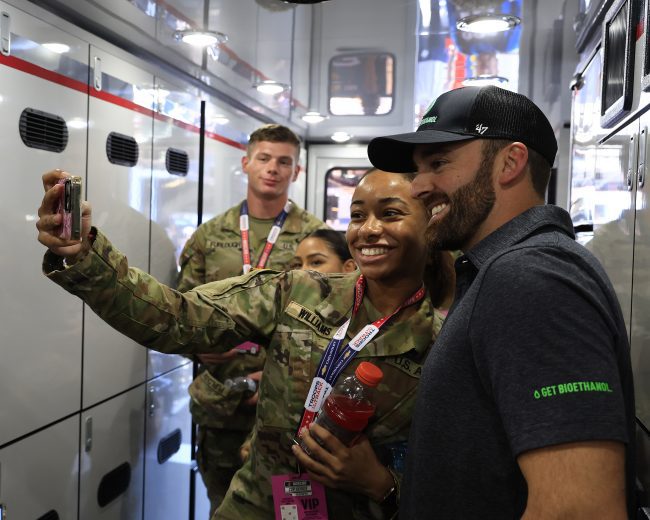 Austin Dillon takes a selfie with a U.S. military service member.