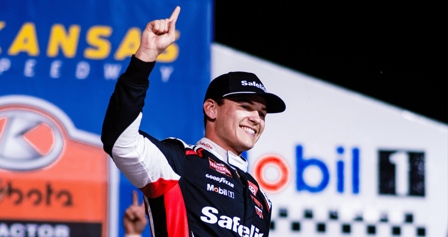 Corey Heim celebrates in Victory Lane at Kansas Speedway.