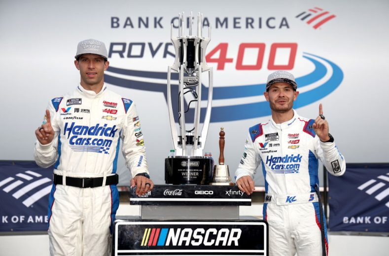 Cliff Daniels (L) poses for a photo in Victory Lane with Kyle Larson (R) at the Charlotte Motor Speedway Roval.