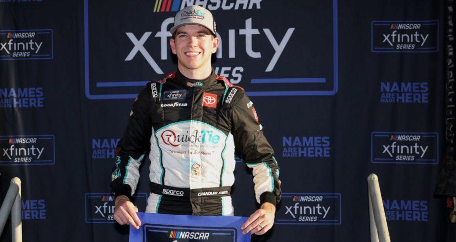 Chandler Smith celebrates after winning the pole at Homestead-Miami.
