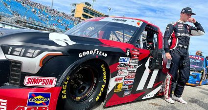 Corey Heim wipes his face after exiting his No. 11 truck post-race at Homestead-Miami Speedway
