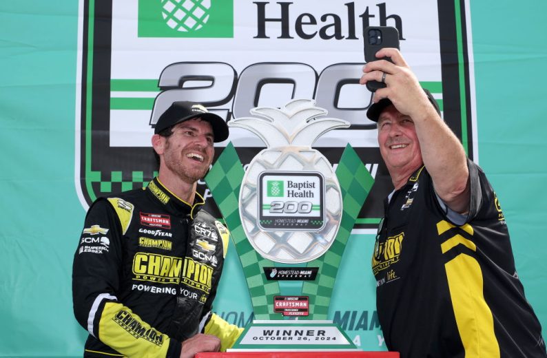 Grant Enfinger takes a selfie with a crew member in Victory Lane at Homestead-Miami Speedway.