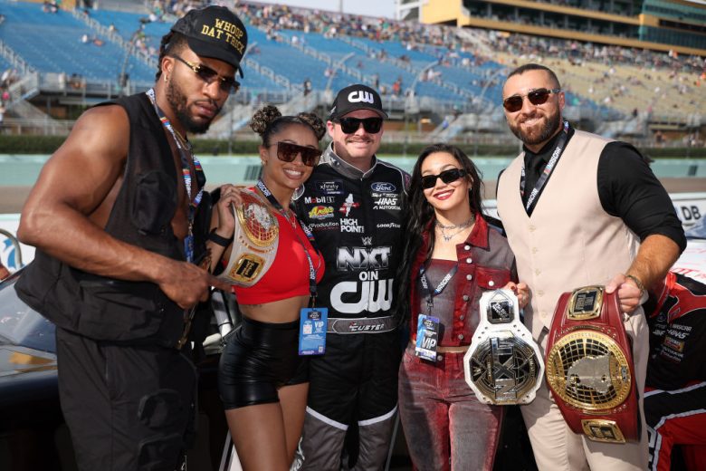 Cole Custer poses with WWE NXT stars.