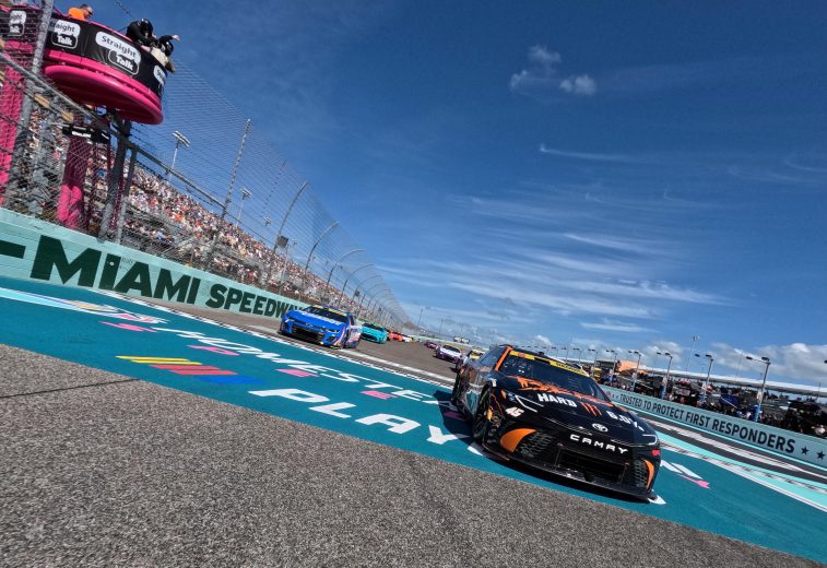 NASCAR Cup Series cars race at Homestead-Miami Speedway.