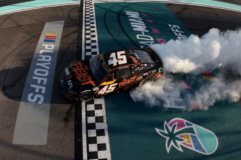 Tyler Reddick's No. 45 Toyota does a victory burnout.
